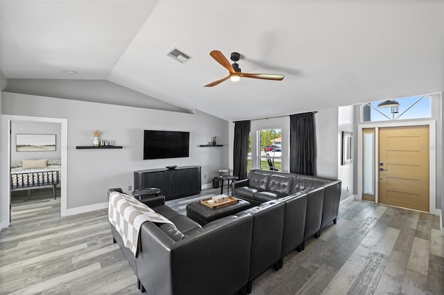1953 Wheeling Ave, North Port, FL 34288 - living area with lofted ceiling, ceiling fan, and light wood-style flooring