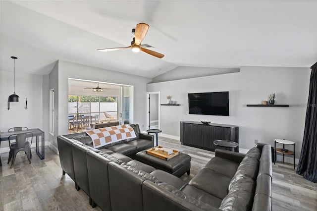 living room with wood-type flooring and lofted ceiling