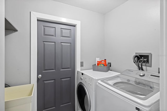 laundry area featuring washing machine and clothes dryer