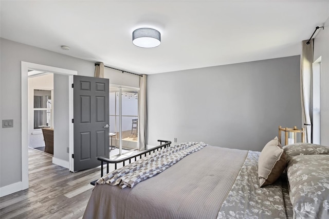1953 Wheeling Ave, North Port, FL 34288 - bedroom featuring wood finished floors and baseboards