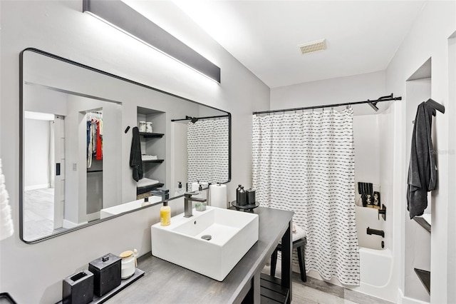 1953 Wheeling Ave, North Port, FL 34288 - bathroom featuring shower / tub combo, wood finished floors, and vanity