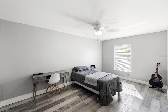 bedroom featuring ceiling fan and hardwood / wood-style floors