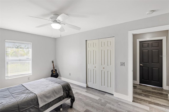 bedroom with ceiling fan and light hardwood / wood-style floors