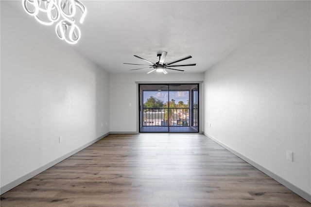 spare room with ceiling fan and light hardwood / wood-style flooring