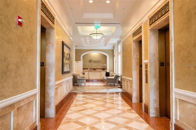 hallway with crown molding, elevator, and a tray ceiling