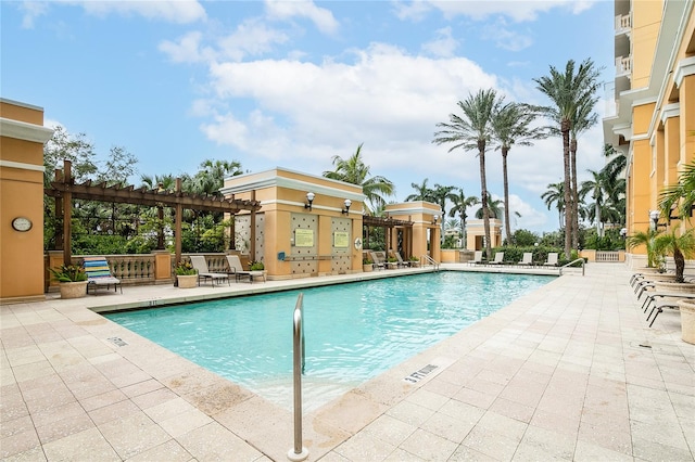 view of swimming pool with a pergola and a patio