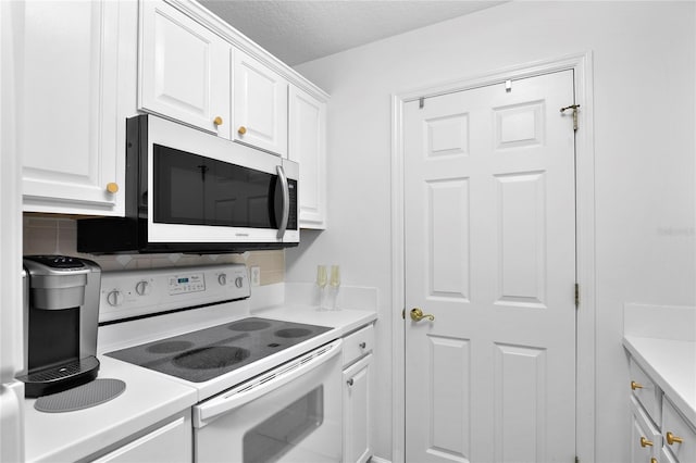 kitchen with white cabinets, a textured ceiling, white electric stove, and backsplash