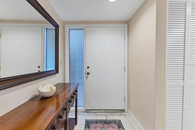 entryway with light tile patterned floors