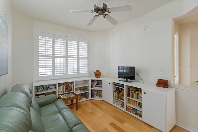 living room featuring ceiling fan and wood-type flooring