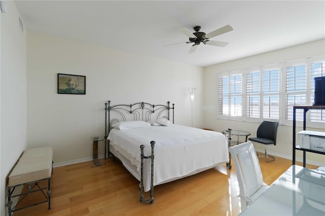 bedroom featuring wood-type flooring and ceiling fan