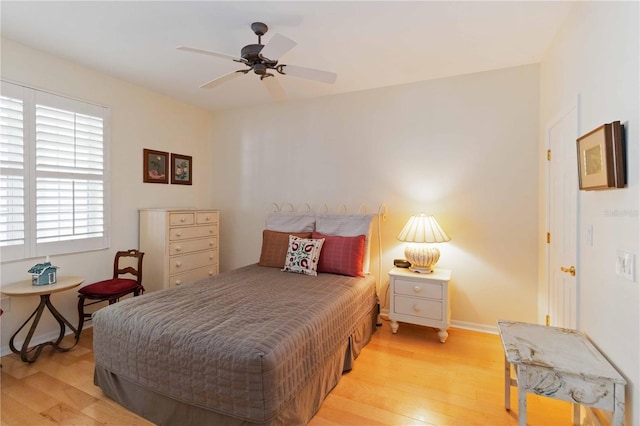 bedroom featuring light hardwood / wood-style flooring and ceiling fan