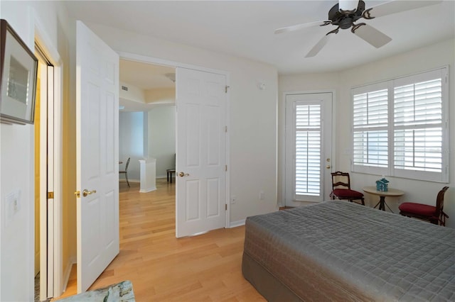 bedroom with ceiling fan and light wood-type flooring