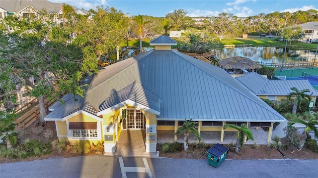 birds eye view of property with a water view