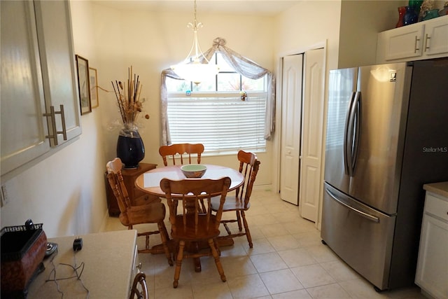 dining space featuring light tile patterned floors