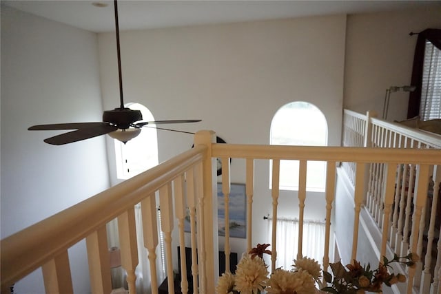 interior space with ceiling fan