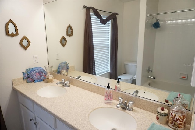 full bathroom featuring shower / bathing tub combination, vanity, and toilet