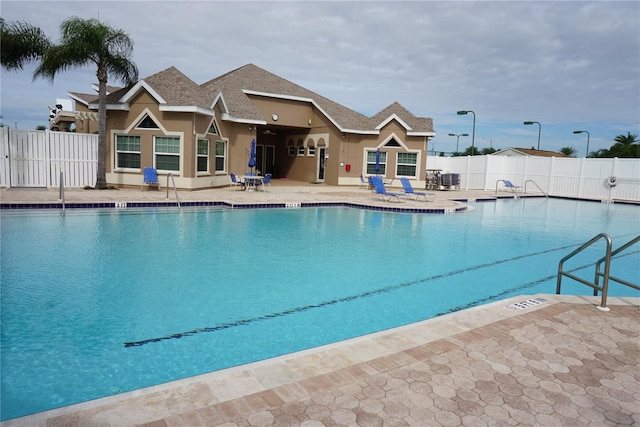 view of swimming pool with a patio