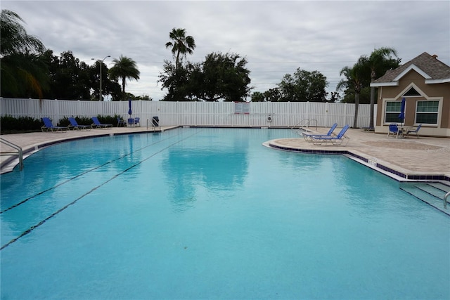 view of swimming pool featuring a patio