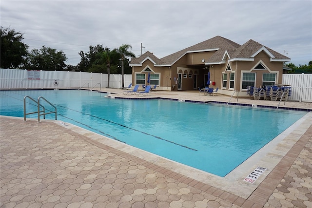 view of swimming pool with a patio area