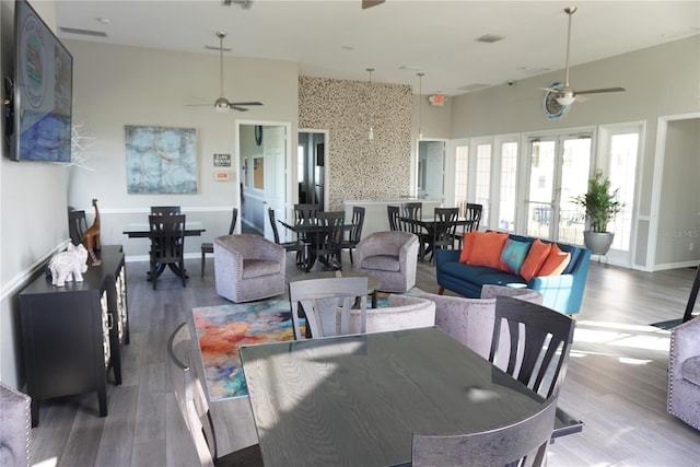 dining area featuring hardwood / wood-style floors and ceiling fan