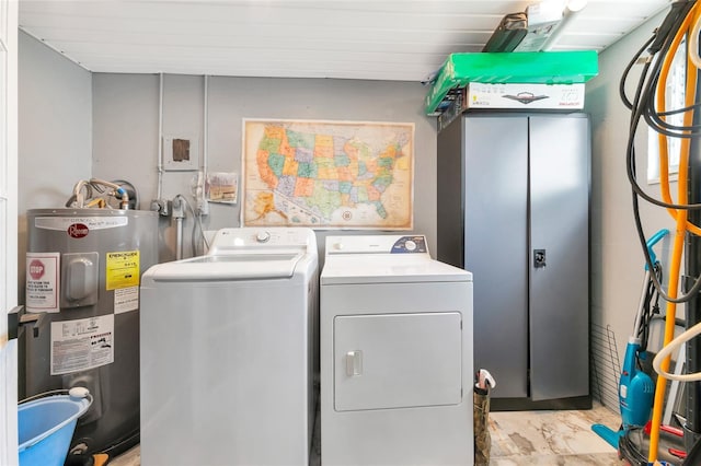 washroom featuring independent washer and dryer and electric water heater