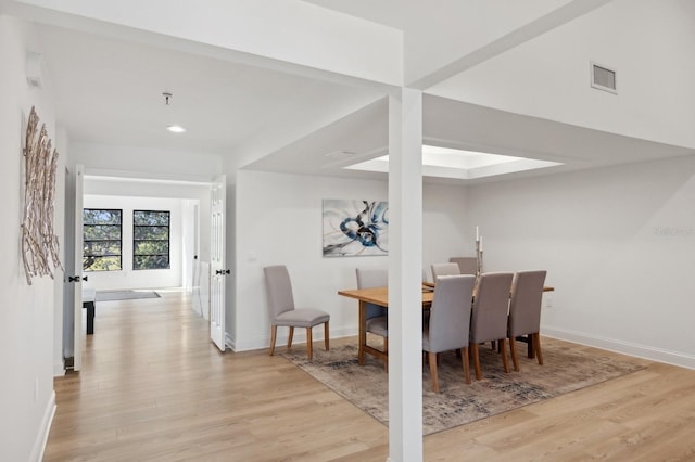 dining area featuring light wood-type flooring