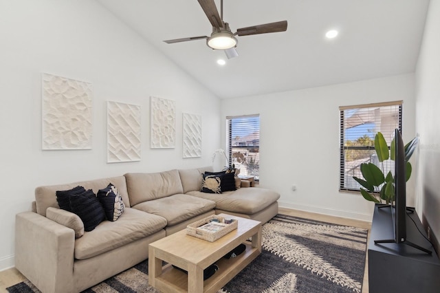 living room featuring ceiling fan, high vaulted ceiling, and light wood-type flooring