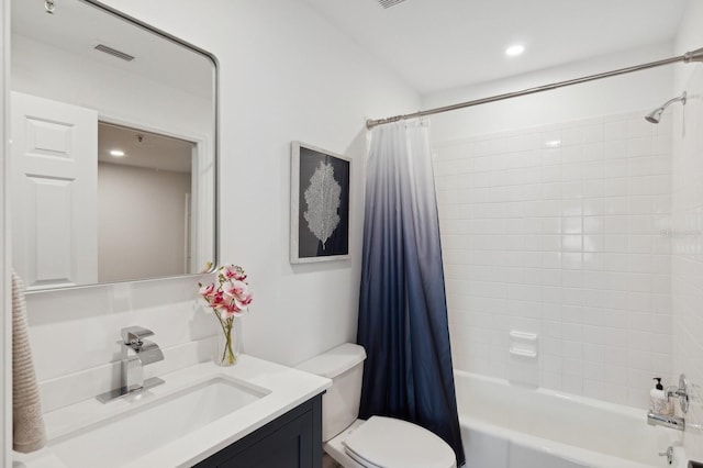 full bathroom featuring vanity, toilet, and shower / tub combo with curtain