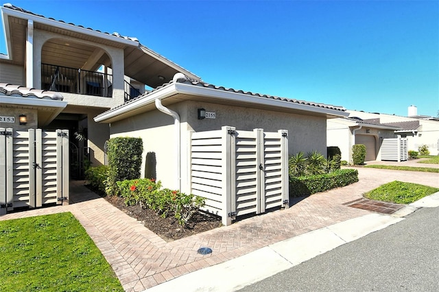 view of side of home with stucco siding