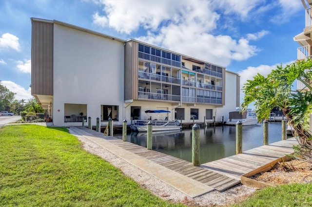 exterior space with a water view and a yard