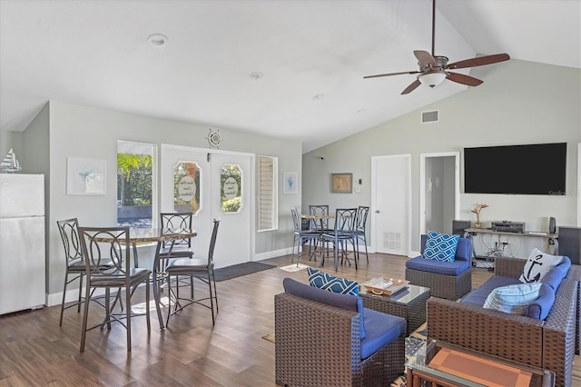 living room with ceiling fan, dark hardwood / wood-style flooring, and lofted ceiling