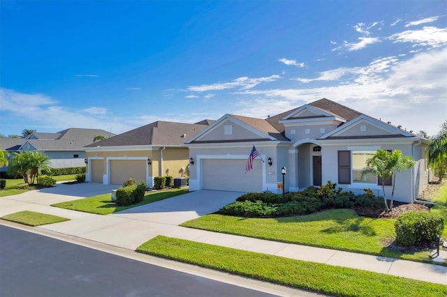 view of front of house featuring a front lawn, central AC unit, and a garage