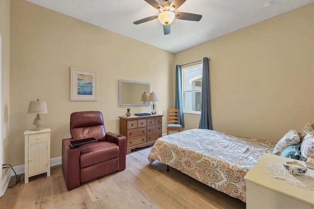 bedroom featuring hardwood / wood-style flooring and ceiling fan