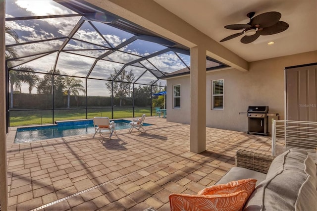 view of patio featuring outdoor lounge area, grilling area, ceiling fan, and a lanai