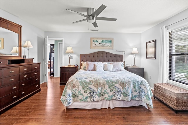 bedroom featuring ceiling fan and dark hardwood / wood-style flooring