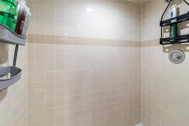 bathroom with tiled shower