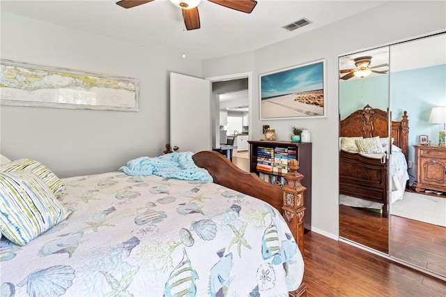 bedroom featuring wood-type flooring, a closet, and ceiling fan