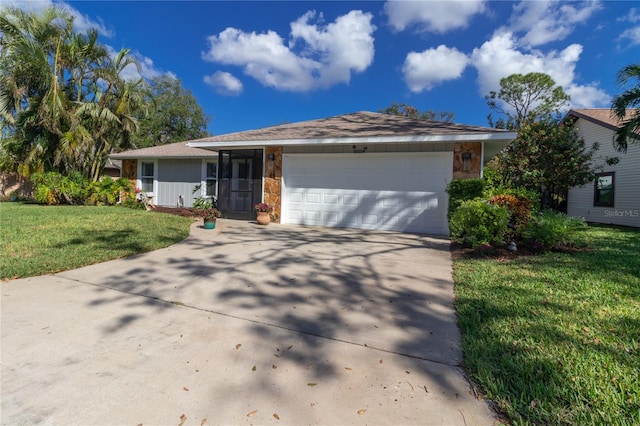 ranch-style home featuring a garage and a front lawn