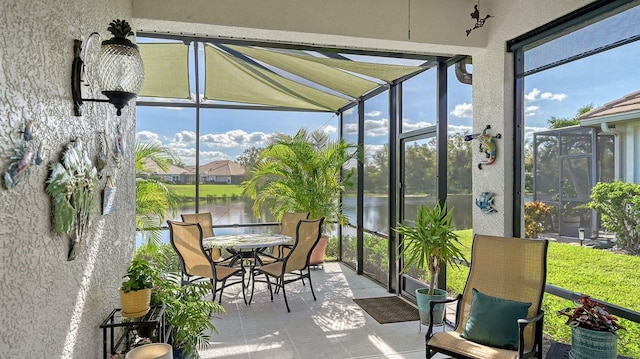 sunroom with a water view