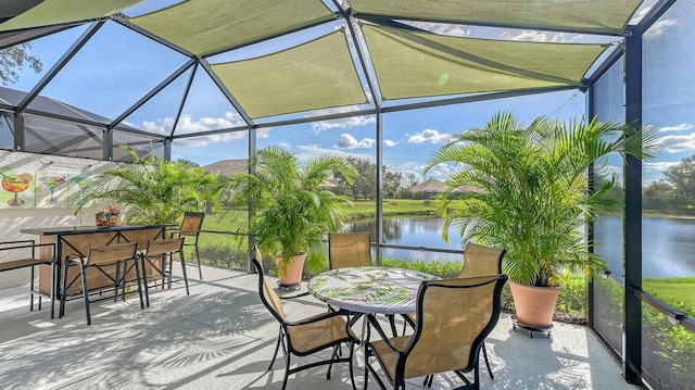 sunroom / solarium with a water view