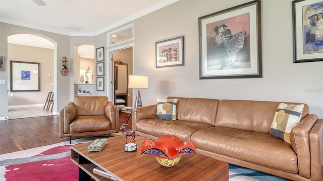 living room featuring light hardwood / wood-style flooring and ornamental molding