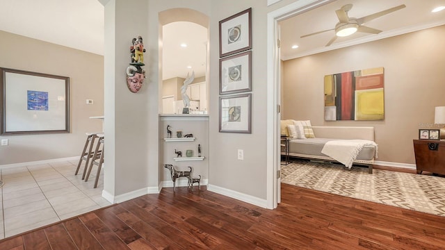 corridor with hardwood / wood-style flooring