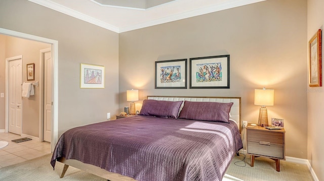 bedroom with light tile patterned floors and crown molding