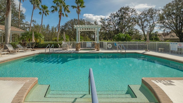 view of swimming pool with a patio area and a pergola