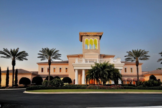 view of outdoor building at dusk