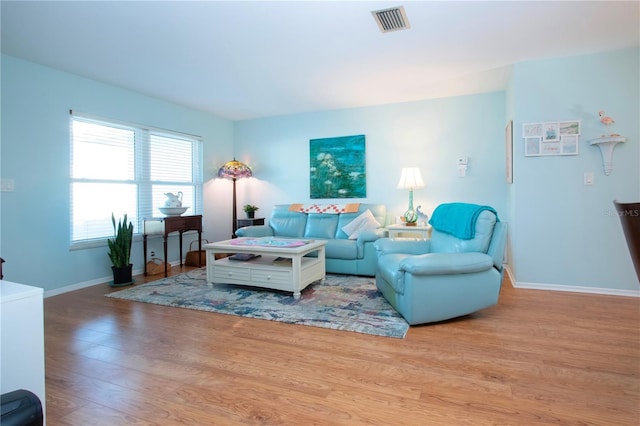 living room with light hardwood / wood-style floors