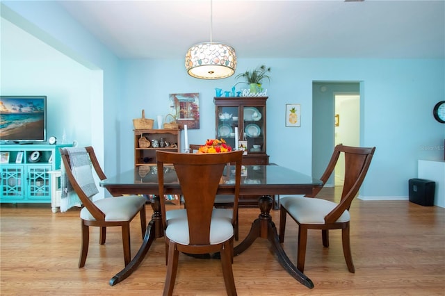 dining area with wood-type flooring