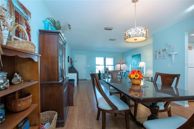 dining room with hardwood / wood-style floors