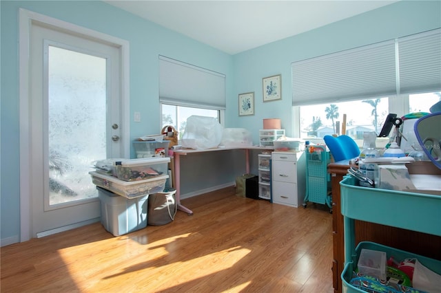 office space with a wealth of natural light and light wood-type flooring