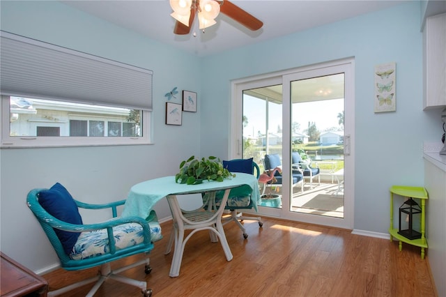 dining space featuring hardwood / wood-style flooring and ceiling fan